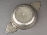 a silver object with a broken wing on it