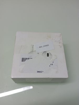 a white box with a label on it sitting on a table