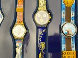 five watches that are on display in a display case