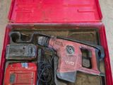 an image of a red tool box filled with tools on top of a floor