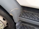 a close up of a truck tire with a hole in the front