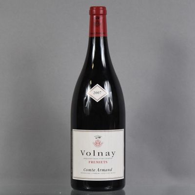 the bottle of red wine is sitting on the table