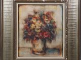 painting of a vase of flowers in a gold frame on a wall