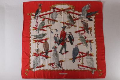 an image of a red scarf with birds on it