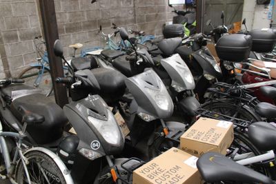 a lot of scooters that are parked next to each other