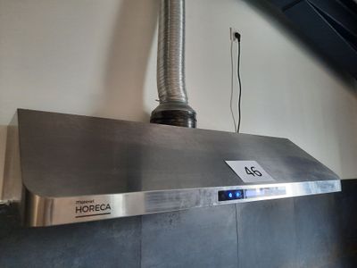 a stainless steel range hood with a digital clock on it