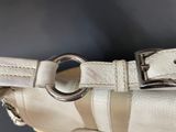 an image of a white purse with a metal ring