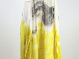 an image of a yellow and white dress on a mannequin stand