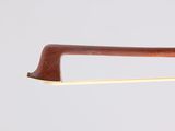 a close up of a violin bow on a white background