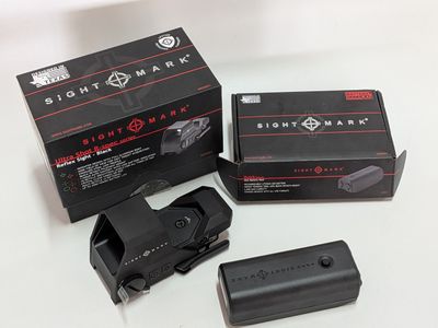 a black box with a red dot on it and a black box with a red dot on it