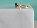 marble block with a ring on top of it on a table