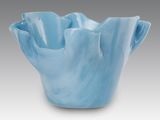 a close up of a blue bowl on a white surface