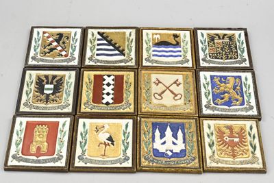 nine tiles of different colors and designs on a white surface