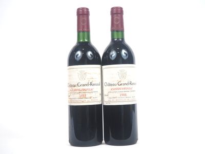 deux bouteilles de vin posées l'une à côté de l'autre sur une table
