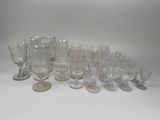 a lot of empty wine glasses on the table
