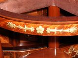 a round table with a wooden top and a wooden base