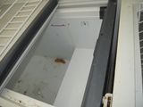 an open refrigerator door with a dirty window in it
