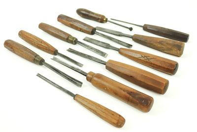 several different types of woodworking tools are lined up on a white surface