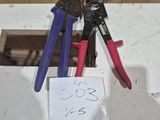 two pliers and two pliers on a table