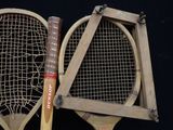 two tennis rackets that are next to each other