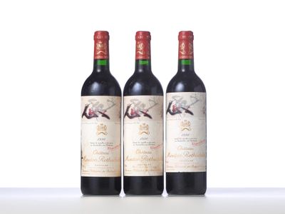 three bottles of wine sitting on top of a table next to each other