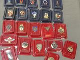 a table with a lot of badges and medals on it