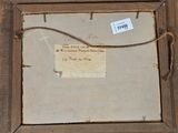 an old picture of a piece of paper hanging on a wooden frame