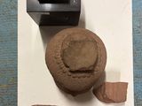 a small piece of clay next to a small piece of clay