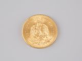 an image of a close up of a gold coin on a white surface