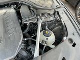 a close up of a car ' s engine with its hood open