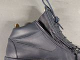 a pair of shoes with zippers on them