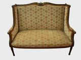 an image of a chair with a floral upholstered back and arms