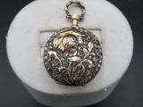 an image of a gold locke with a rose on it