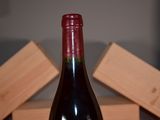 a bottle of wine that is sitting on a table