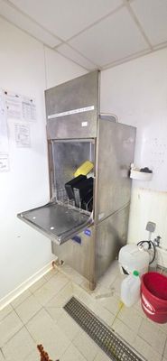 a small kitchen with a sink and a stove in it