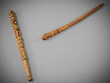 a wooden stick and a wooden stick on a table
