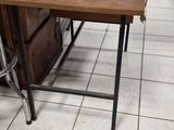 a bird cage sitting on top of a table in a store