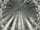 a close up of a glass plate with a circular design on it