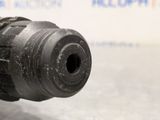 a close up of a drill on a table