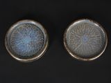 pair of blue and white dishes on a black surface