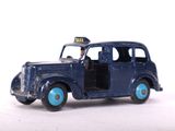a blue toy car with a taxi sign on it