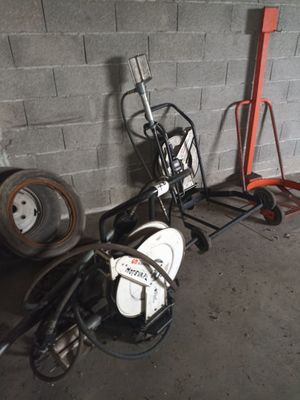 a motorcycle that is parked next to a cart