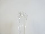 a clear glass vase sitting on top of a wooden table