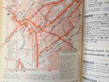 an open book with a map of paris on it