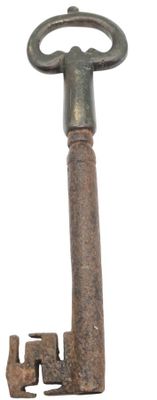 an old key that is sitting on top of a table