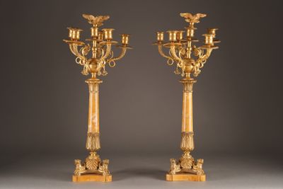 pair of antique brass candelabs with eagle heads