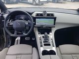a picture of a car dashboard with a steering wheel and dashboard controls