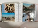 an open book with pictures of people and animals on it