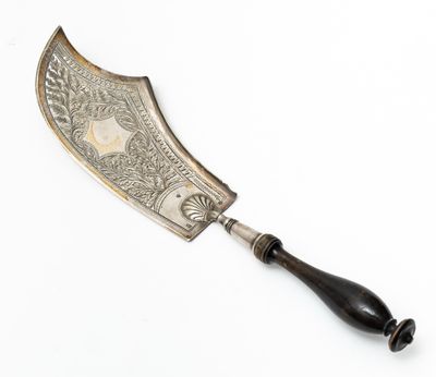 an antique silver plated knife with a black handle on a white background
