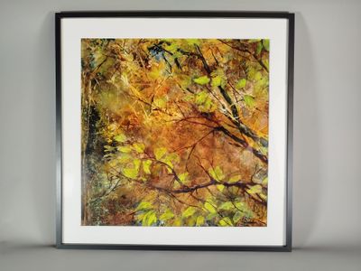 a painting of a tree with yellow leaves in a black frame